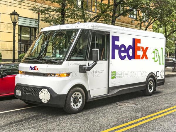 Federal Express electric delivery truck and street scene, Manhattan, New York City, New York, USA