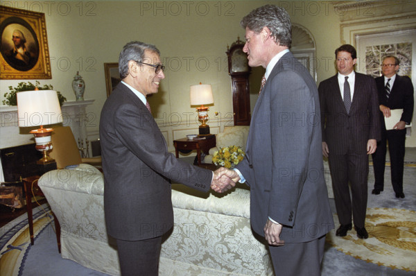U.S. President Bill Clinton shaking hands with United Nations Secretary-General Boutros Boutros-Ghali as U.S. Vice President Al Gore looks on in Oval Office of the White House, Washington, D.C., USA, Bob McNeely, White House Photographer, February 23, 1993