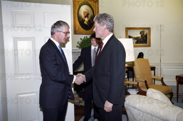 U.S. President Bill Clinton shaking hands with British Prime Minister John Major, Oval Office, White House, Washington, D.C., USA, Bob McNeely, White House Photographer, February 24, 1993