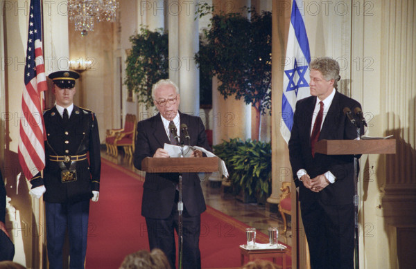 U.S. President Bill Clinton looking on as Israeli Prime Minister Yitzhak Rabin delivers press statement, East Room, White House, Washington, D.C., USA, Bob McNeely, White House Photographer, March 15, 1993
