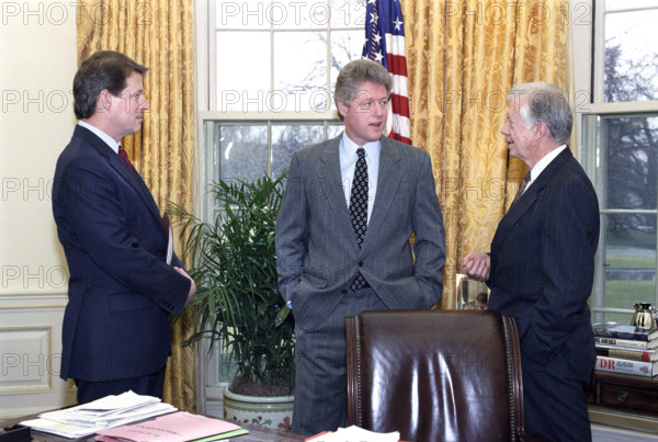 U.S. President Bill Clinton and U.S. Vice President Al Gore meeting with former U.S. President Jimmy Carter in the oval office of the White House, Washington, D.C., USA, Barbara Kinney, White House photographer, March 4, 1993