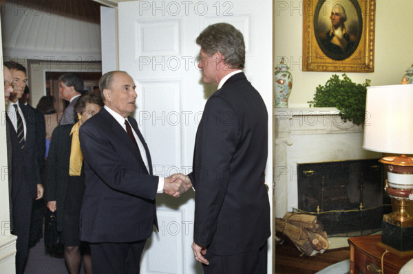 U.S. President Bill Clinton greeting French President François Mitterrand of France as he arrives at the West Wing entrance of the White House, Washington, D.C., USA, Bob McNeely, White House Photographer, March 9, 1993