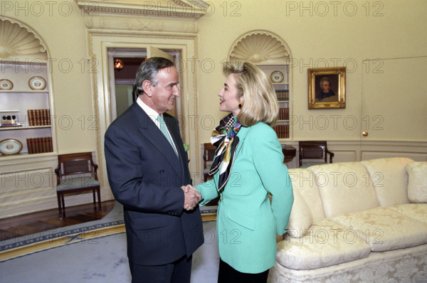 U.S. First Lady Hillary Clinton shaking hands with Irish Prime Minister Albert Reynolds during meeting in the Oval Office of the White House, Washington, D.C., USA, Bob McNeely, White House Photographer, March 17, 1993