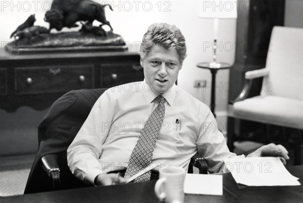 U.S. President Bill Clinton sitting at  conference table during meeting in the White House, Washington, D.C., USA, Bob McNeely, White House Photographer, March 25, 1993