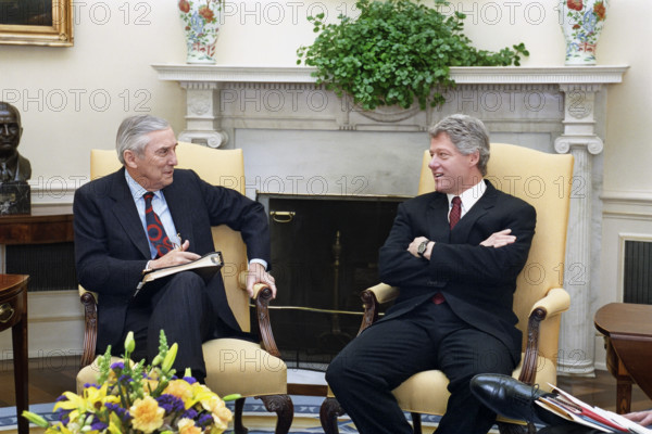 U.S. President Bill Clinton meeting with U.S. Secretary of the Treasury  Lloyd Bentsen in the Oval Office of the White House, Washington, D.C., USA, Barbara Kinney, White House Photographer, March 26, 1993