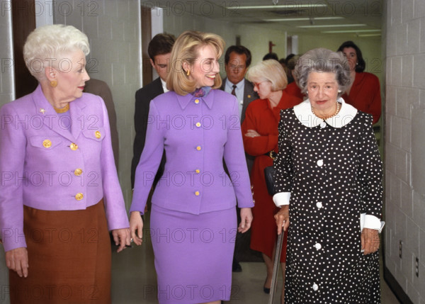 U.S. First Lady Hillary Rodham Clinton (center) walking with Texas Governor Ann Richards (left) and former U.S. First Lady Claudia 'Lady Bird' Johnson (right) at the Liz Carpenter Lectureship Event at the Erwin Center, University of Texas, Austin, Texas, USA, Ralph Alswang, White House Photographer, April 6, 1993
