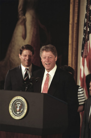 U.S. President Bill Clinton and U.S. Vice President Al Gore standing at podium after swearing-in the first members of his cabinet, White House, Washington, D.C., USA, Barbara Kinney, White House Photographer, January 22, 1993