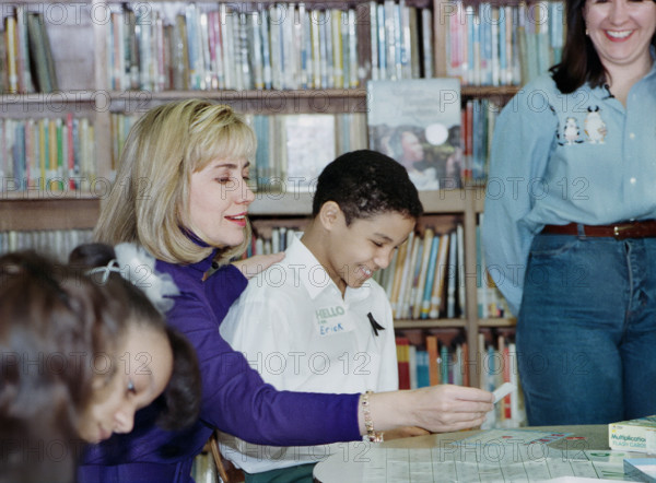 U.S. First Lady Hillary Rodham Clinton participating in  "New York Cares" tutoring session with children at Public School 115, New York City, New York, USA, Barbara Kinney, White House Photographer, January 26, 1993