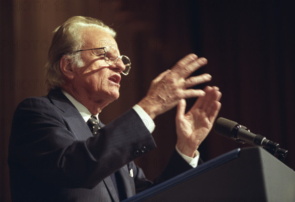 American evangelist Billy Graham speaking at annual National Prayer Breakfast, Washington, D.C., USA, Ralph Alswang, White House Photographer, February 4, 1993