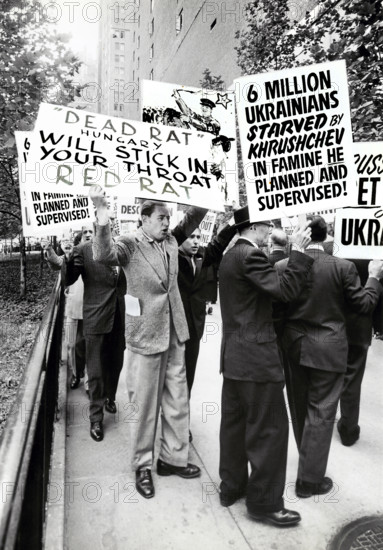 Group of people with signs protesting Soviet Leader Nikita Khrushchev's visit to United Nations, New York City, New York, USA, Angelo Rizzuto, Anthony Angel Collection, September 18, 1959