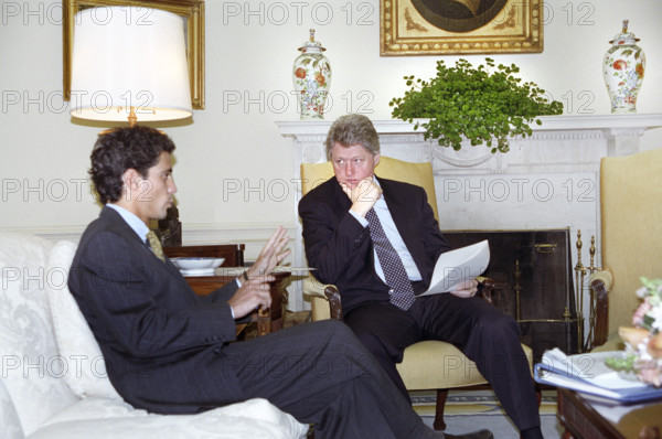 U.S. President Bill Clinton meeting with U.S. presidential senior advisor Rahm Emanuel in the Oval Office, White House, Washington, D.C., USA, Bob McNeely, White House Photographer, February 25, 1993