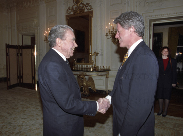 U.S. President Bill Clinton shaking hands with former U.S. President Richard Nixon in private residence, White House, Washington, D.C., USA, Bob McNeely, White House Photographer, March 8, 1993