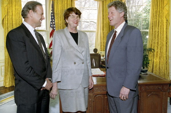 U.S. Senator Joseph Biden and newly-appointed U.S. Attorney General Janet Reno with U.S. President Bill Clinton in the Oval Office, White House, Washington, D.C., USA, Bob McNeely, White House Photographer, March 11, 1993