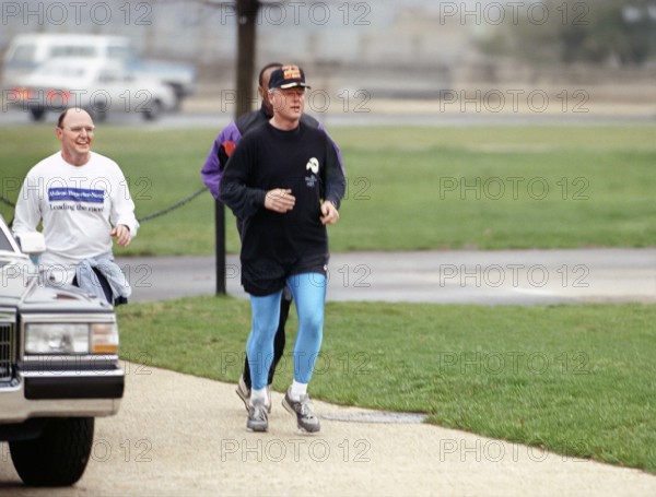 U.S. President Bill Clinton jogging around reflecting pool, Washington, D.C., USA, Sharon Farmer, White House photographer, April 1, 1993