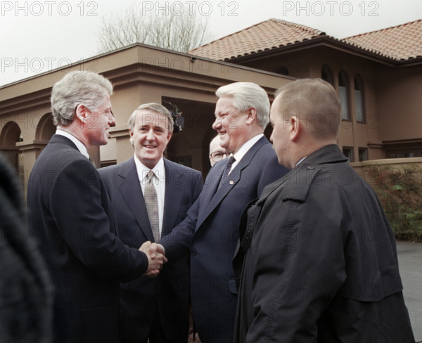 U.S. President Bill Clinton shaking hands with Russian President Boris Yeltsin as Canadian Prime Minister Brian Mulroney looks on outside the University of British Columbia President's residence, Vancouver, British Columbia, Canada, Bob McNeely, White House Photographer, April 3, 1993