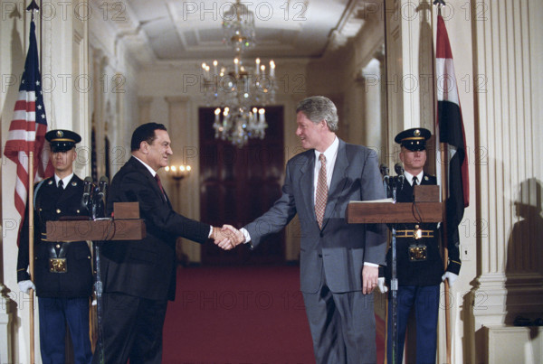 U.S. President Bill Clinton and Egyptian President Hosni Mubarak shaking hands during joint press conference in the East Room of the White House, Washington, D.C., USA, Bob McNeely, White House Photographer, April 6, 1993
