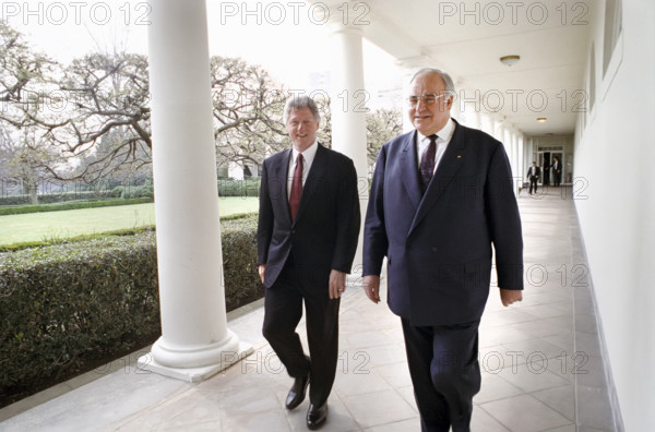 U.S. President Bill Clinton and German Chancellor Helmut Kohl walking along the colonnade at the White House, Washington, D.C., USA, Barbara Kinney, White House Photographer, March 26, 1993