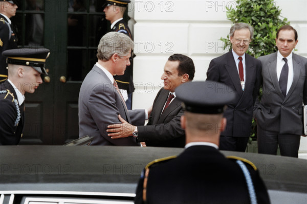 U.S. President Bill Clinton and others saying farewell to Egyptian President Hosni Mubarak as he leaves the White House, Washington, D.C., USA, Sharon Farmer, White House Photographer, April 6, 1993