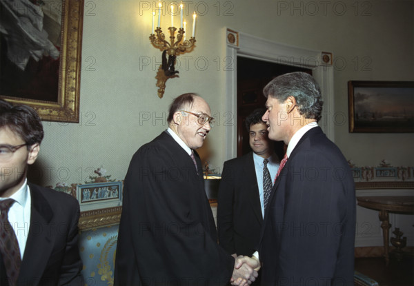 U.S. President Bill Clinton shaking hands with Chief Justice of the U.S. William Rehnquist in the East Room of the White House, Washington, D.C., USA, Bob McNeely, White House Photographer, January 22, 1993