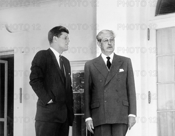 U.S. President John F. Kennedy and British Prime Minister Harold MacMillan standing in the West Wing Colonnade of the White House, Washington, D.C., USA, Abbie Rowe, White House Photographs, April 8, 1961