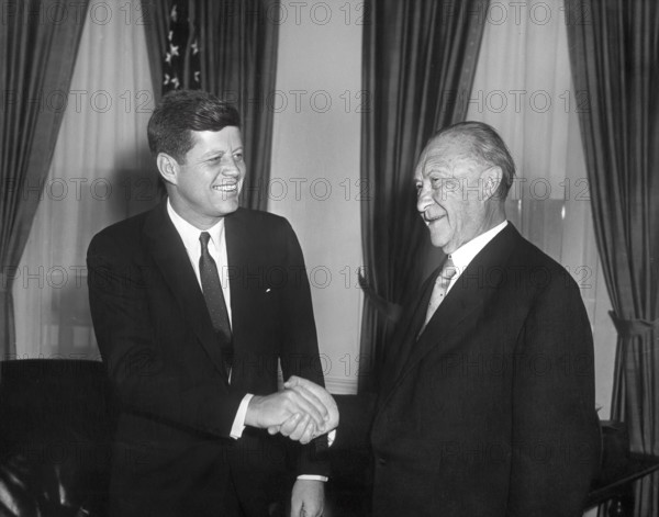 U.S. President John F. Kennedy shaking hands with West German Chancelor Konrad Adenauer in the oval office of the White House, Washington, D.C., USA, Abbie Rowe, White House Photographs, April 12, 1961