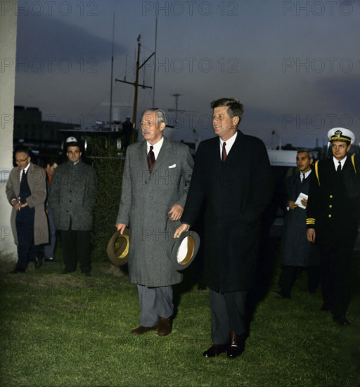 U.S. President John F. Kennedy with British Prime Minister Harold MacMillan walking away from Presidential yacht "Honey Fitz" following afternoon meetings on the Potomac River, Washington, D.C., USA, Robert Knudsen, White House Photographs, April 6, 1961