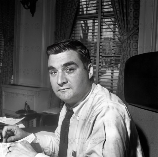 U.S. Press Secretary Pierre Salinger sitting in his office in the White House, Washington, D.C., USA, Cecil Stoughton, White House Photographs, April 25, 1961