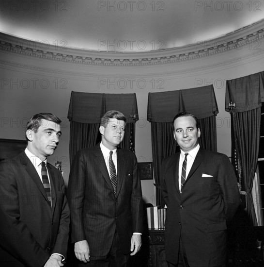 U.S. President John F. Kennedy meeting with Publisher of News Ltd. of Australia, Rupert Murdoch (right), and New York reporter for the Daily Mirror, Zell Rabin in the Oval Office, White House, Washington, D.C., USA, Cecil Stoughton, White House Photographs, December 1, 1961