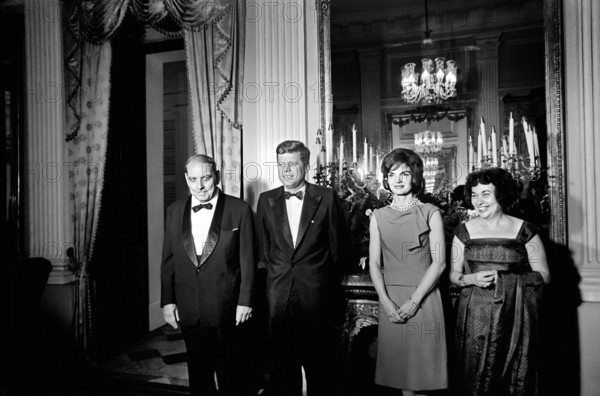 U.S. President John F. Kennedy and U.S. First Lady Jacqueline Kennedy attending dinner hosted by Governor of Puerto Rico Luis Muñoz Marín (far left) and  First Lady of Puerto Rico Inés Mendoza (far right) at the Governor’s mansion, San Juan, Puerto Rico, Cecil Stoughton, White House Photographs, December 15, 1961