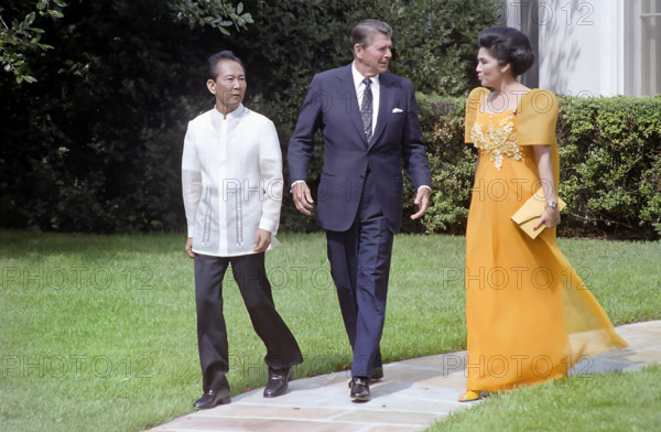 U.S. President Ronald Reagan with President of The Philippines Ferdinand Marcos and Imelda Marcos during a state visit outside the Oval Office of the White House, Washington, D.C., USA, President Ronald Reagan White House Photographic Office, September 16, 1982