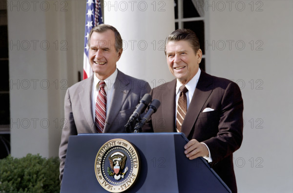 U.S. President Ronald Reagan and U.S. Vice President George H.W. Bush speaking to the press in the Rose Garden, White House, Washington, D.C., USA, President Ronald Reagan White House Photographic Office, November 3, 1982