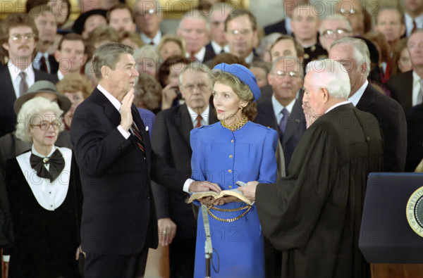 U.S. President Ronald Reagan Being sworn in for a second term by U.S. Chief Justice Warren Burger as Nancy Reagan observes in the U.S. Capitol Rotunda, Washington, D.C., USA, President Ronald Reagan White House Photographic Office, January 21, 1985