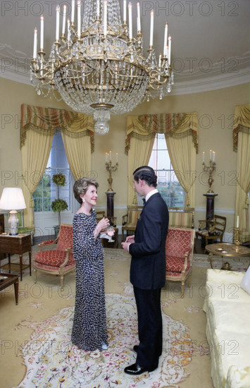 U.S. First Lady Nancy Reagan with Prince Charles in the Yellow Oval Room during private dinner for The Prince of Wales, White House, Washington, D.C., USA, President Ronald Reagan White House Photographic Office, May 2, 1981