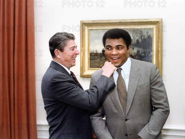 U.S. President Ronald Reagan "punching" American boxer Muhammad Ali in the Oval Office of the White House, Washington, D.C., USA, President Ronald Reagan White House Photographic Office, January 24, 1983