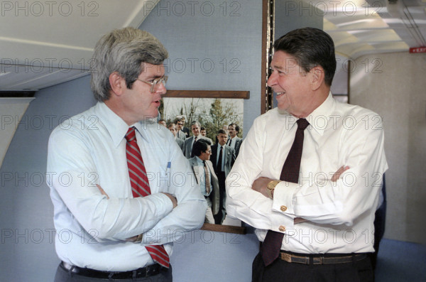 U.S. President Ronald Reagan Talking with U.S. Congressman Newt Gingrich during trip Atlanta, Georgia, USA, via Air Force One, President Ronald Reagan White House Photographic Office, August 1, 1983
