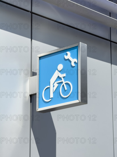Bicycle tire pump and repair sign along urban bicycle path, Manhattan, New York City, New York, USA