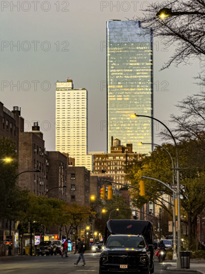 Street scene at dusk, Ninth Avenue at 16th Street, looking north to Hudson Yards, Manhattan, New York City, New York, USA