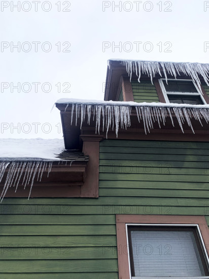 Icicles hanging from rooftop