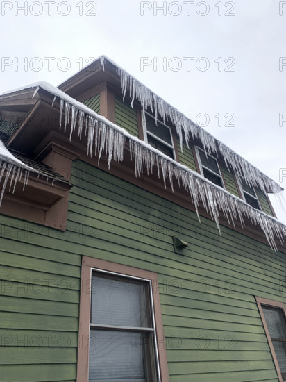 Icicles hanging from rooftop