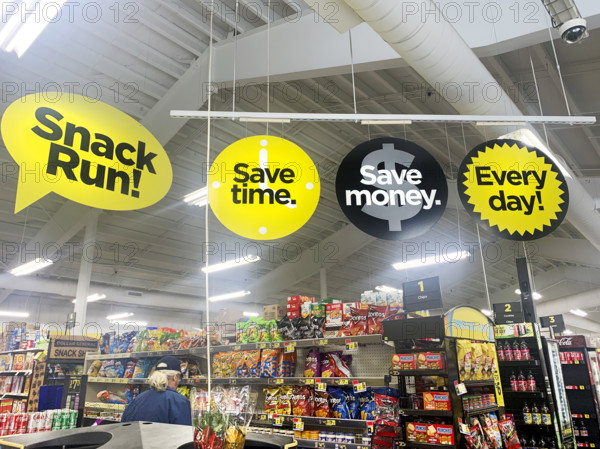 Man shopping for snacks in Dollar General supermarket