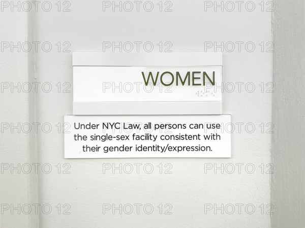Sign for public bathroom allowing all persons the right to use single-sex facility consistent with their gender identity/expression, New York City, New York, USA