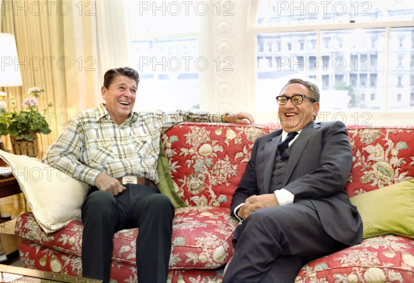 U.S. President Ronald Reagan meeting with former U.S. Secretary of State Henry Kissinger in the private residence of the White House, Washington, D.C., USA, President Ronald Reagan White House Photographic Office, June 10, 1981