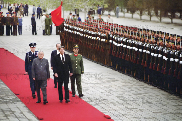 U.S. President Ronald Reagan reviewing Chinese troops during arrival ceremony at Great Hall of The People, Beijing, People's Republic of China, President Ronald Reagan White House Photographic Office, April 26, 1984