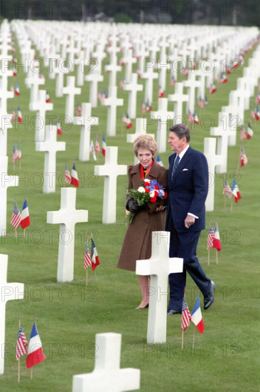 U.S. President Ronald Reagan and U.S. First Lady Nancy Reagan walking through Omaha Beach Cemetery during 40th anniversary of D-Day Landings, Colleville-sur-Mer, France, President Ronald Reagan White House Photographic Office, June 6, 1984