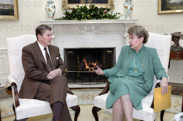 U.S. President Ronald Reagan meeting with U.S. Ambassador to the United Nations Jeane Kirkpatrick in the Oval Office of the White House, Washington, D.C., USA, President Ronald Reagan White House Photographic Office, December 11, 1984