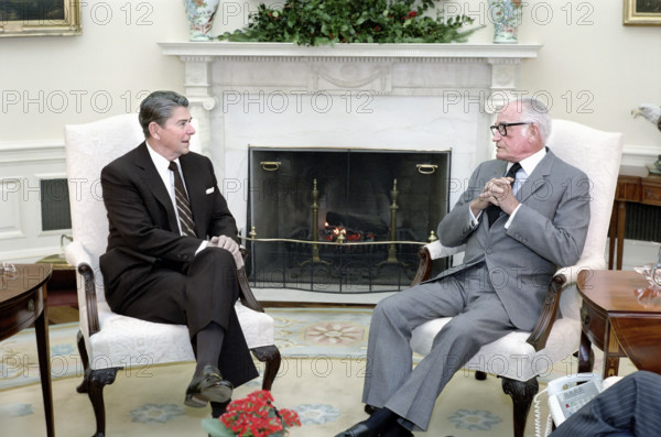 U.S. President Ronald Reagan meeting with Arizona Senator Barry Goldwater in the Oval Office of the White House, Washington, D.C., USA, President Ronald Reagan White House Photographic Office, December 12, 1984