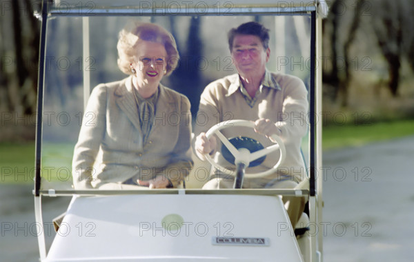 U.S. President Ronald Reagan driving golf cart with British Prime Minister Margaret Thatcher, Camp David, Frederick County, Maryland, USA, President Ronald Reagan White House Photographic Office, December 22, 1984