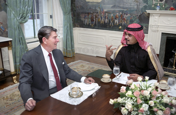 U.S. President Ronald Reagan at private breakfast meeting with Prince Bandar Ibn Sultan Al Saud during state visit of King Fahd of Saudi Arabia, Diplomatic Reception Room, White House, Washington, D.C., USA, President Ronald Reagan White House Photographic Office, February 12, 1985