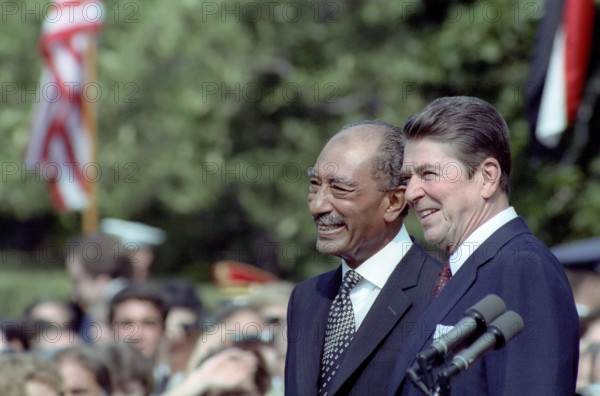 U.S. President Ronald Reagan and Egyptian President Anwar El Sadat on the White House south lawn at the arrival ceremony in honor of Sadat's state visit, Washington, D.C., USA, President Ronald Reagan White House Photographic Office, August 5, 1981