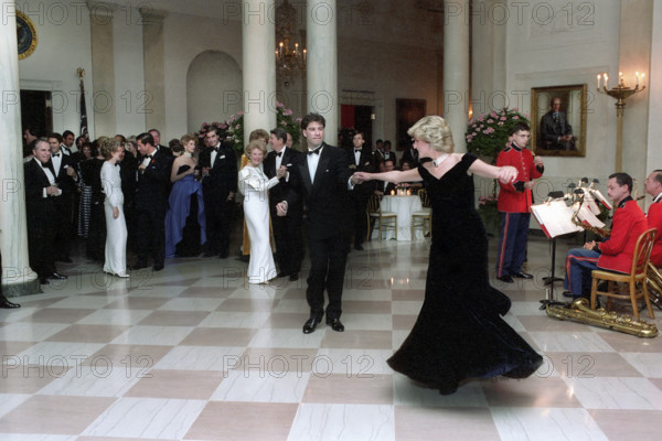 American actor John Travolta dancing with Princess Diana in Cross Hall of the White House, Washington, D.C., USA, President Ronald Reagan White House Photographic Office, November 9, 1985